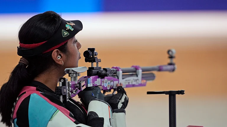 India's Ramita Jindal competes in the 10m air rifle mixed team qualification round at the 2024 Summer Olympics, Saturday, July 27, 2024, in Chateauroux, France. -  (AP Photo/Manish Swarup)